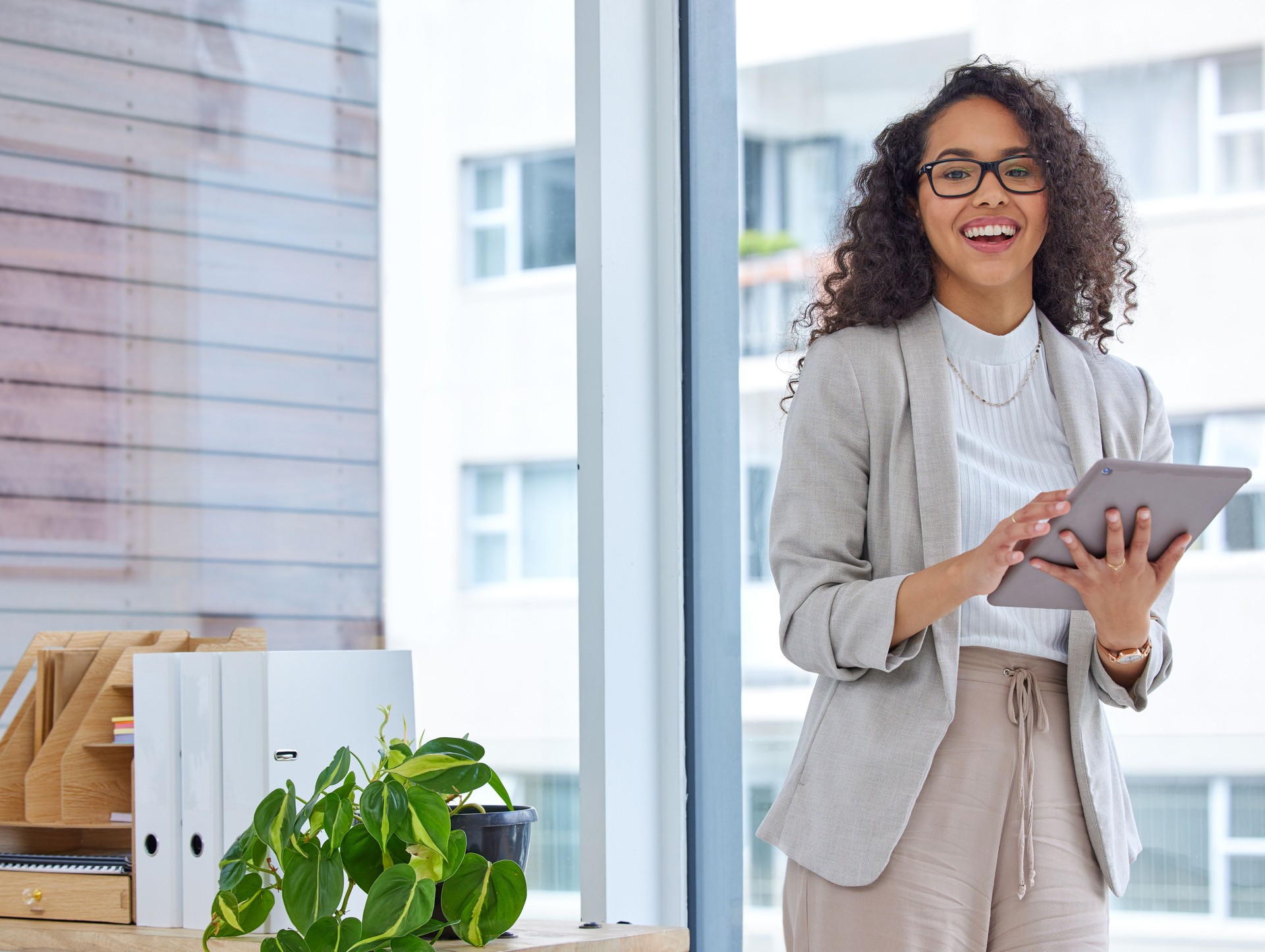 Portrait of a young businesswoman using a digital tablet in an office